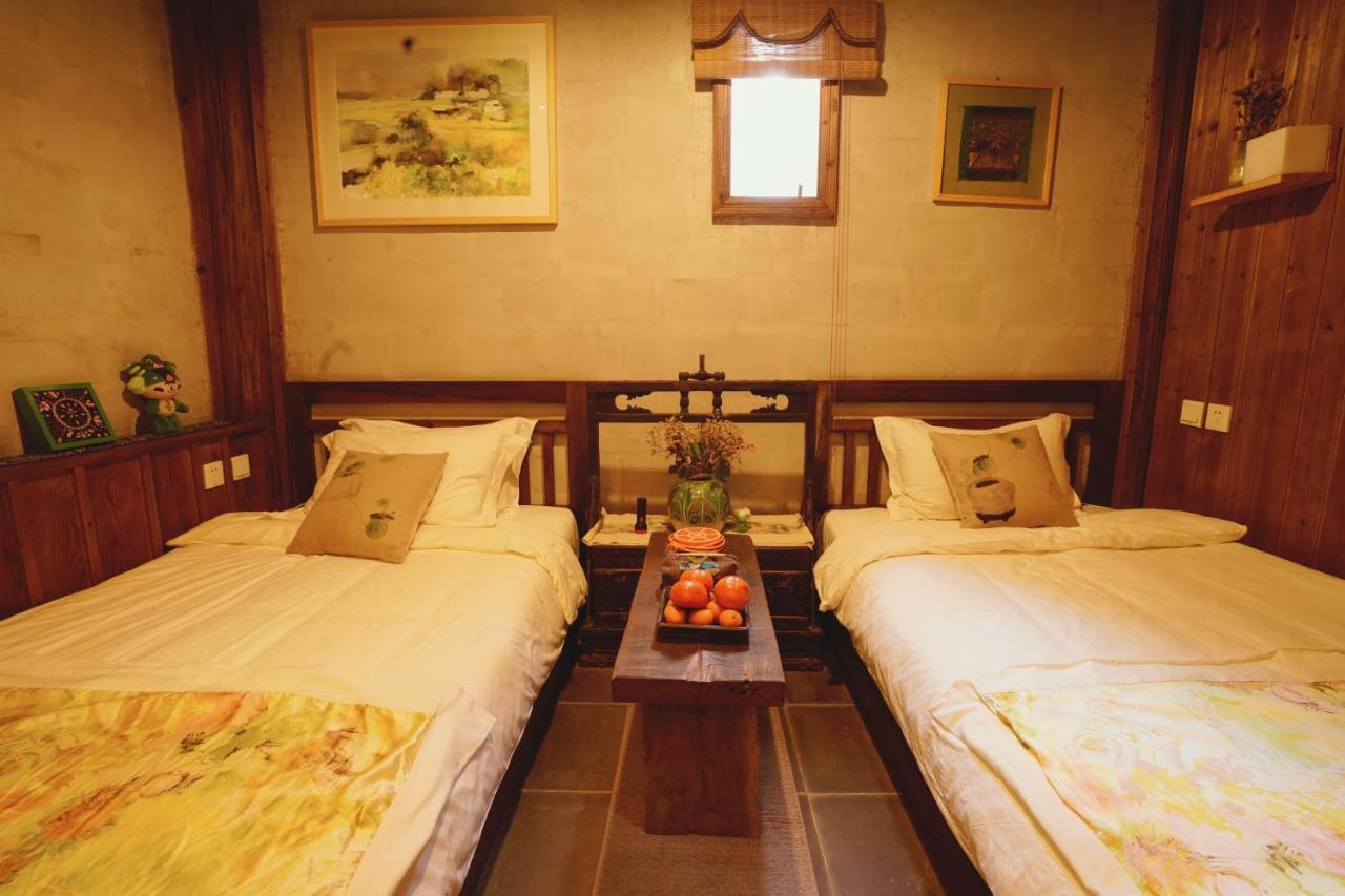 WuYuan QiYe YanXiang Guesthouse Bagian luar foto