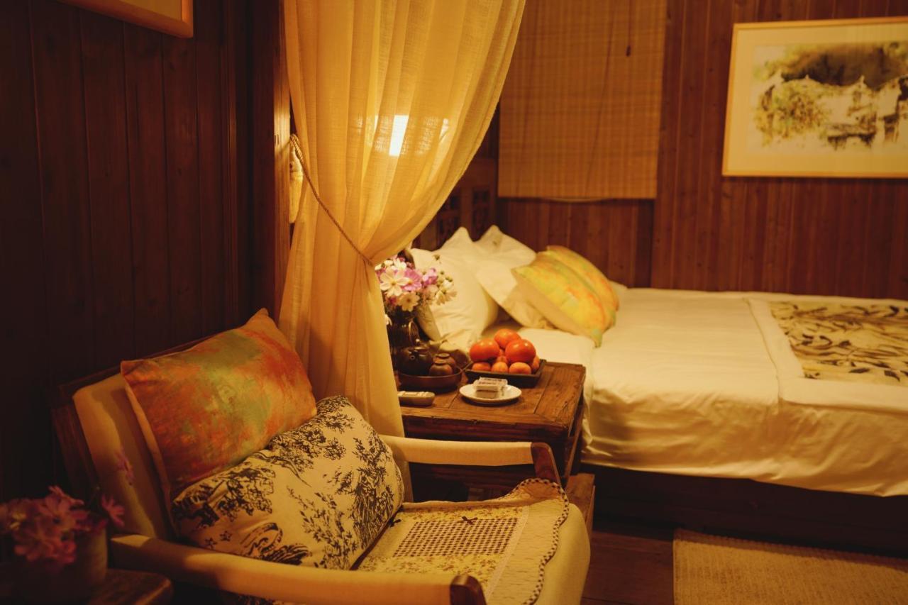 WuYuan QiYe YanXiang Guesthouse Bagian luar foto