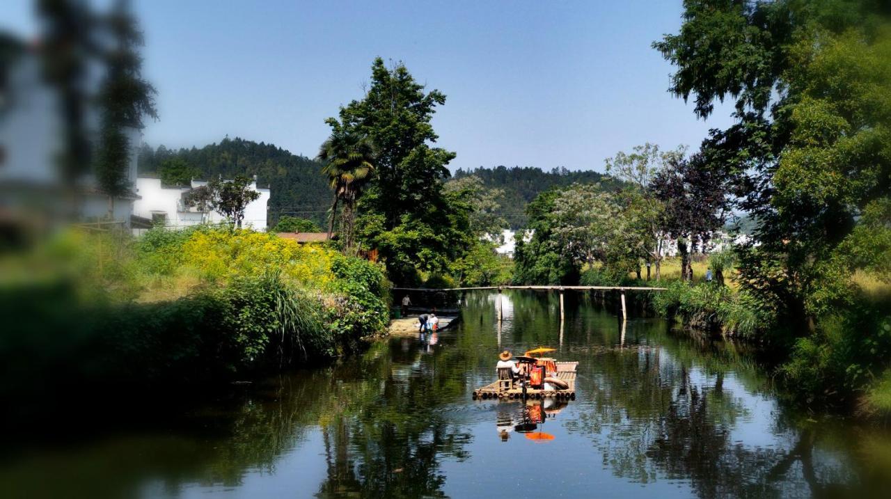 WuYuan QiYe YanXiang Guesthouse Bagian luar foto