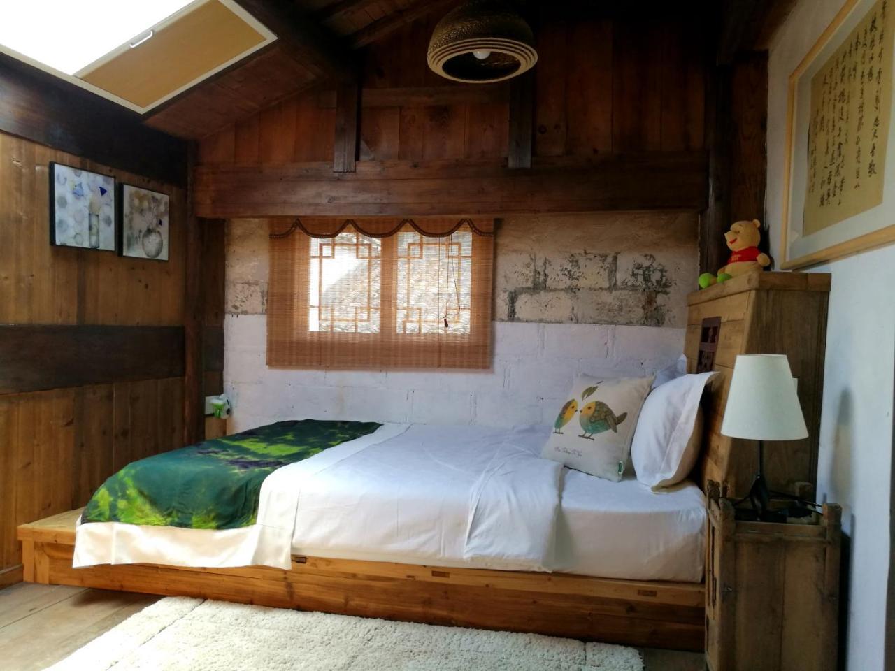 WuYuan QiYe YanXiang Guesthouse Bagian luar foto
